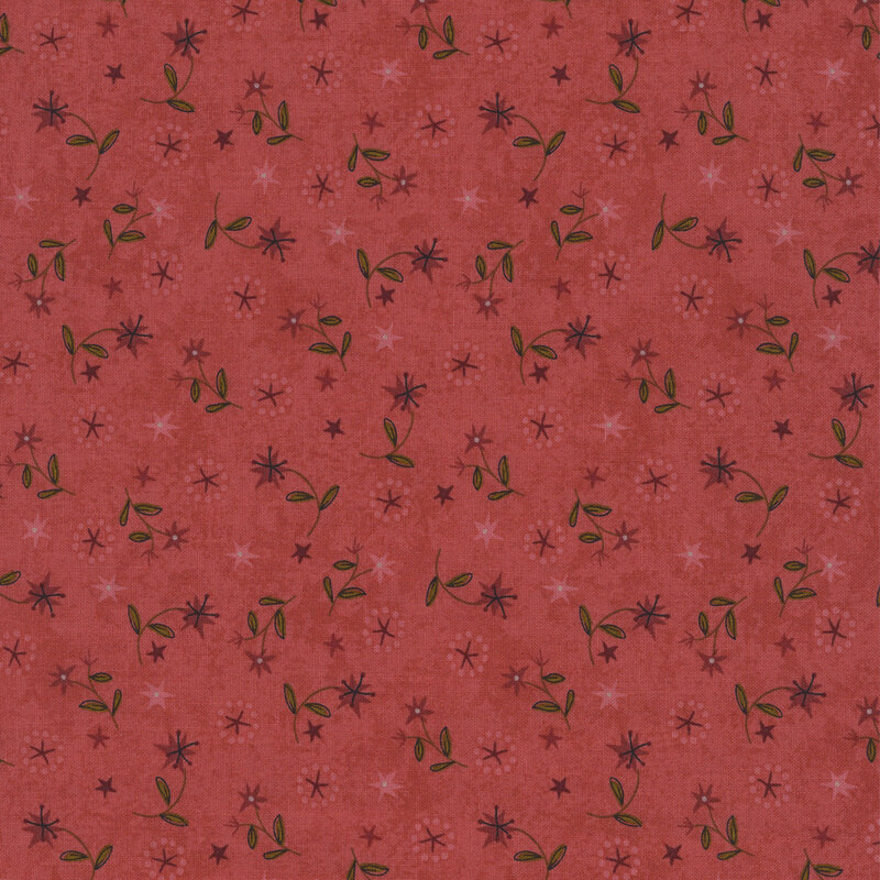wine red lilies with green leaves and stars in maroon and dusty rose tossed on textured rose red fabric