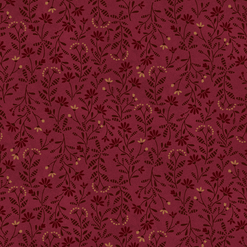 brick red fabric featuring a calico pattern of latte and maroon flowers with dark brown leaves and stems