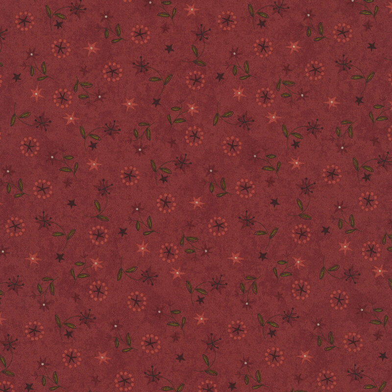 wine red lilies with green leaves and stars in dusty rose and peach tossed on textured burgundy fabric