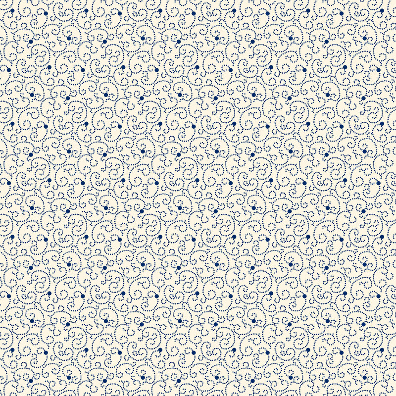 cream fabric featuring blue dots and swirls