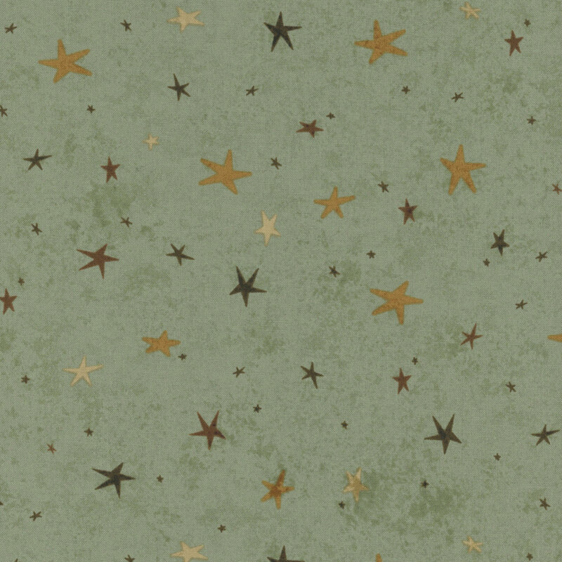 A sage fabric featuring a tonal star-themed design.