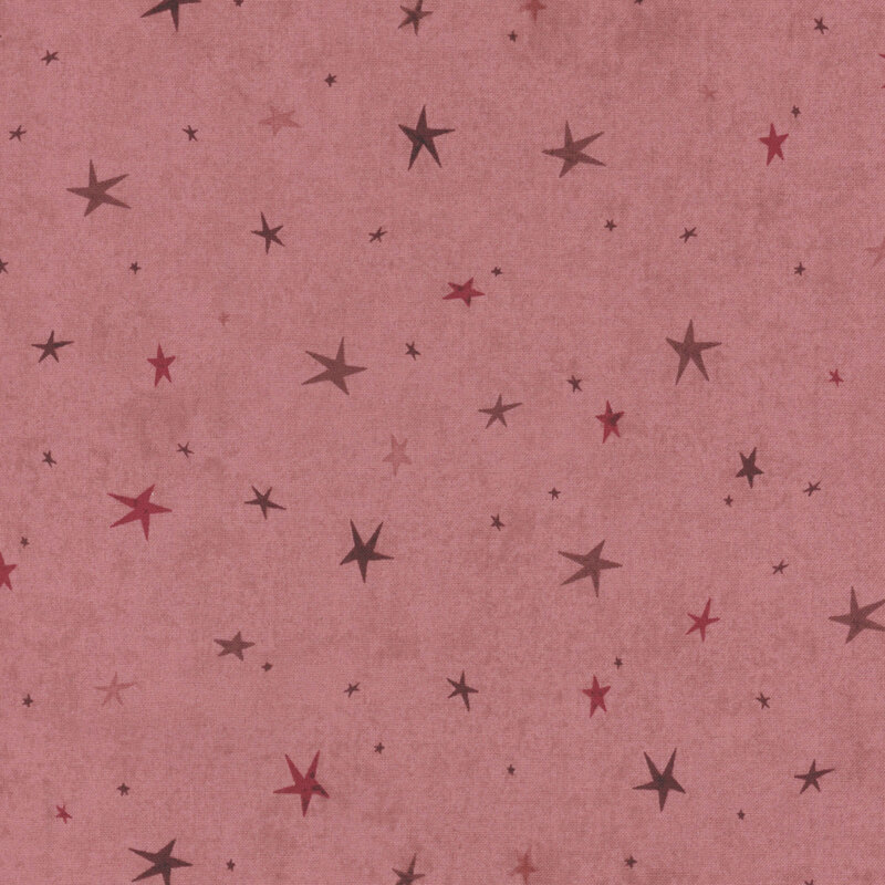 A dark rose fabric featuring a tonal star-themed design.