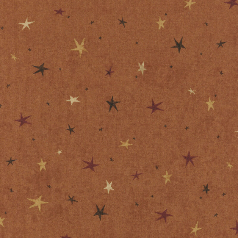 A dark orange fabric featuring a tonal star-themed design.
