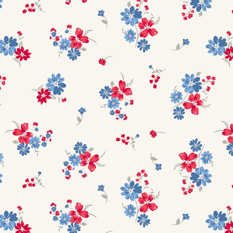 red and blue flowers tossed on white fabric
