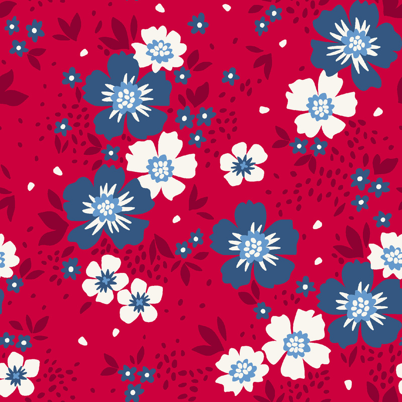 Dark blue and white flowers with dark red leaves tossed on red fabric