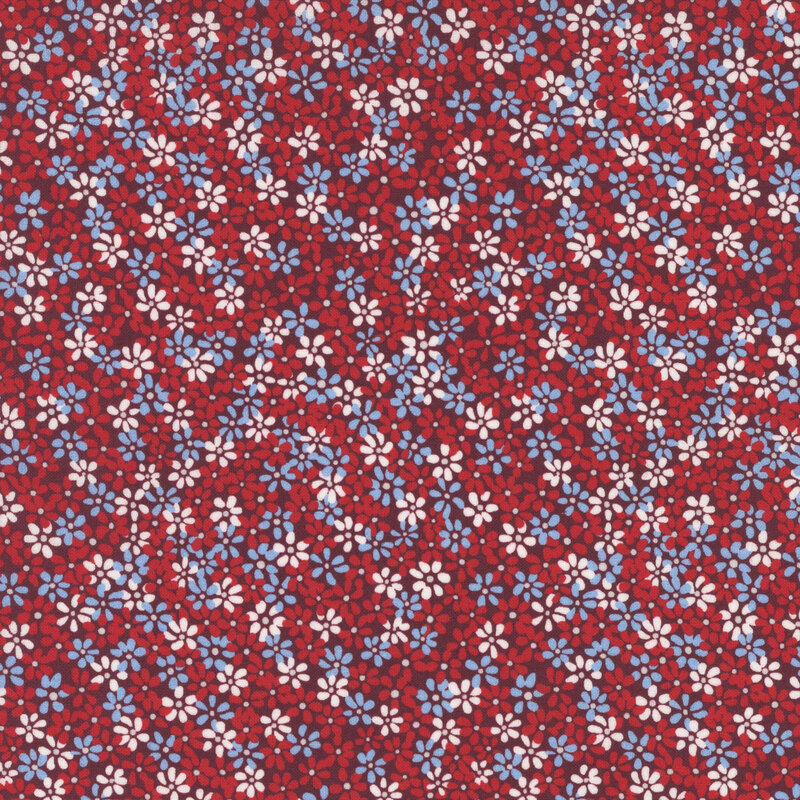 white, blue and bright red flowers packed on dark red fabric