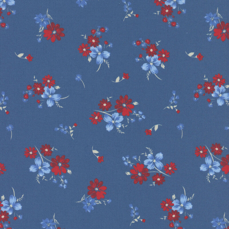 red and light blue flowers tossed on blue fabric