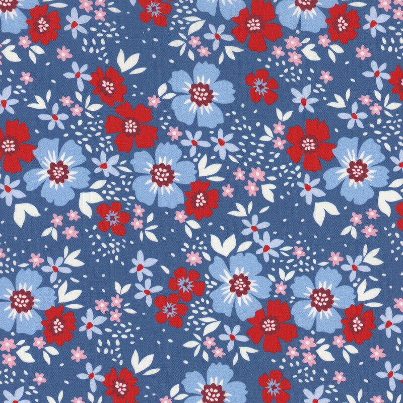 Light blue and red flowers with white leaves tossed on blue fabric
