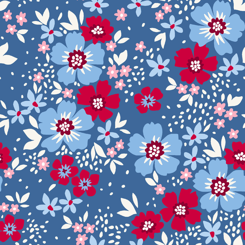 Light blue and red flowers with white leaves tossed on blue fabric