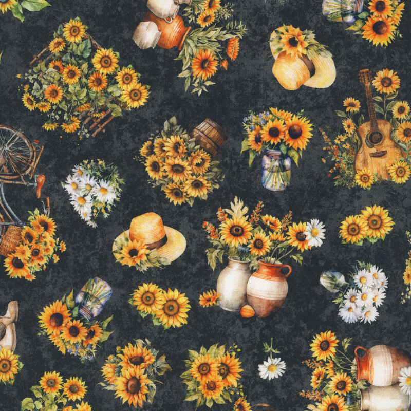Yellow and gold sunflowers in pots, jars, bicycles, and straw hats tossed on mottled soft black fabric