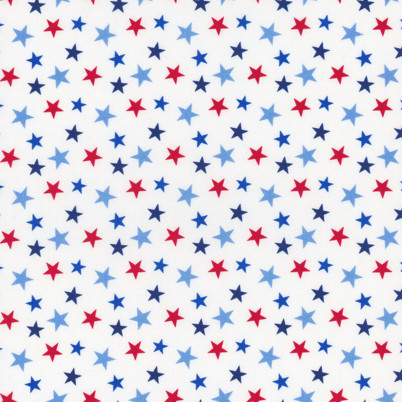 A pattern of variously sized red, blue, and navy stars on a white fabric.