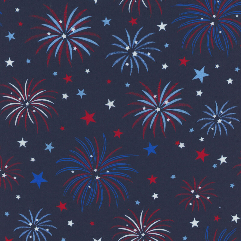 Pattern of red, white, and blue fireworks and stars on a dark blue fabric.