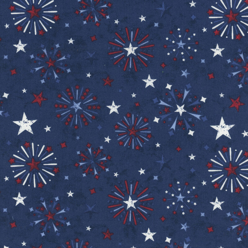 Mottled navy blue fabric tossed with fireworks and stars in red, white, and blue.