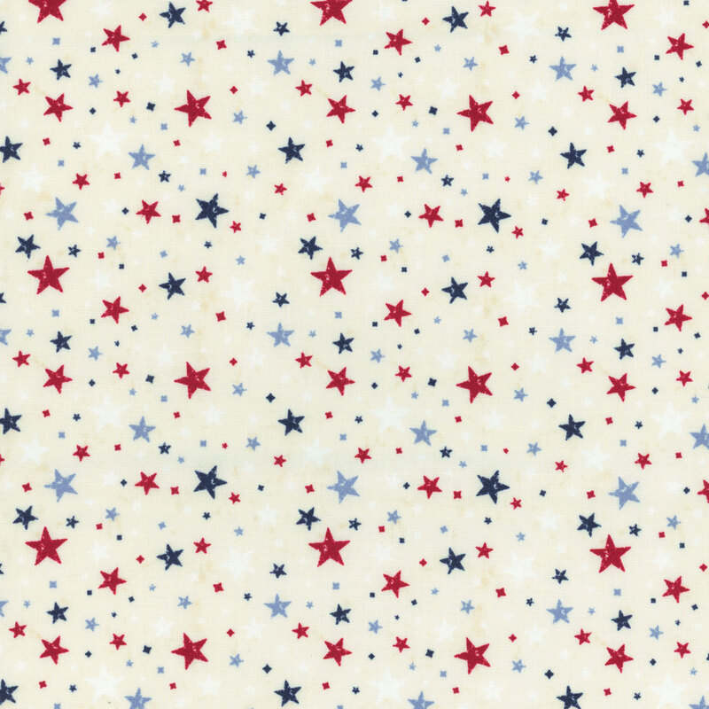Red, white, and blue stars tossed on mottled cream fabric.