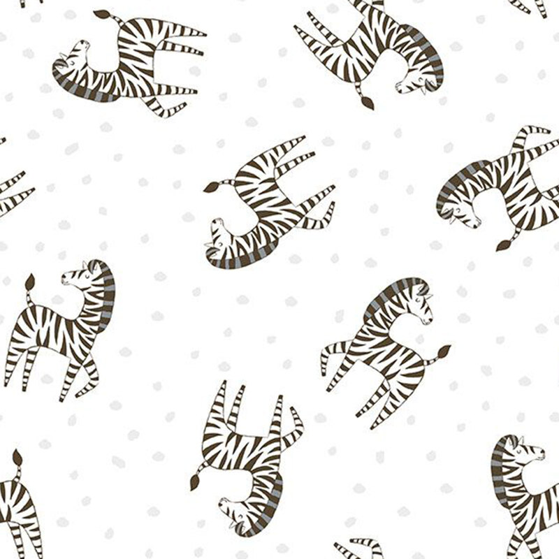 White fabric tossed with stripped zebras and silver dots.