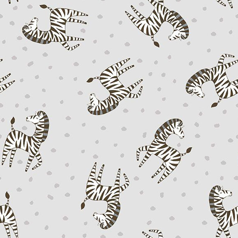 Soft gray fabric tossed with stripped zebras and silver dots.