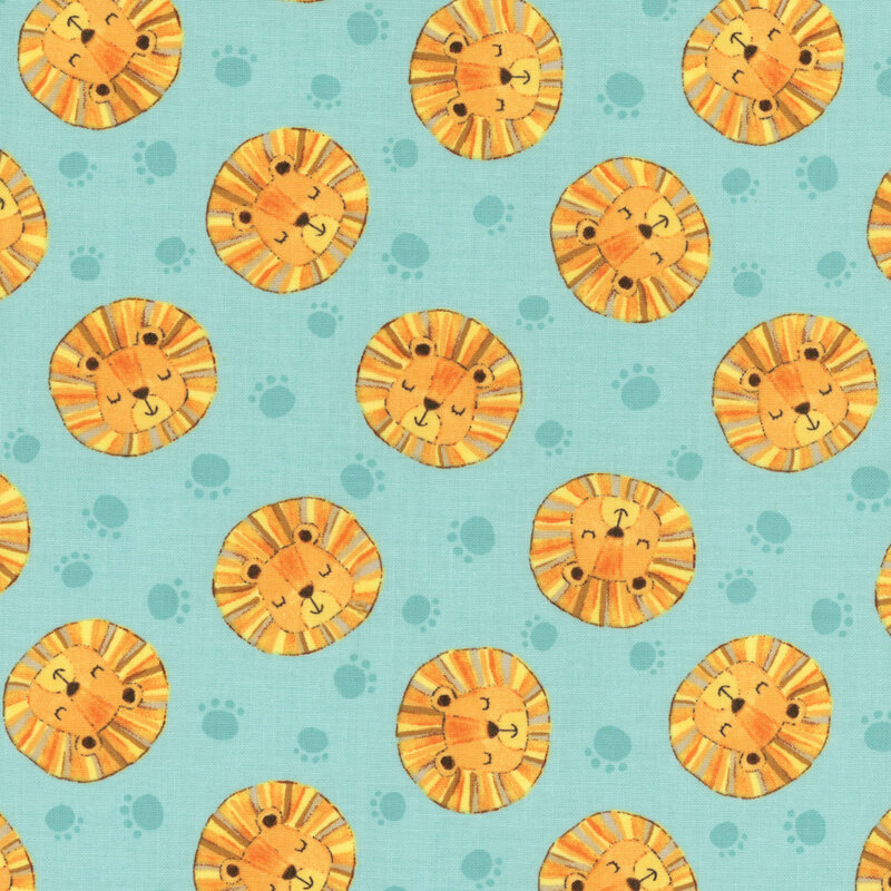 Lion heads in yellow, orange, and gold tossed with aqua paw prints on teal fabric