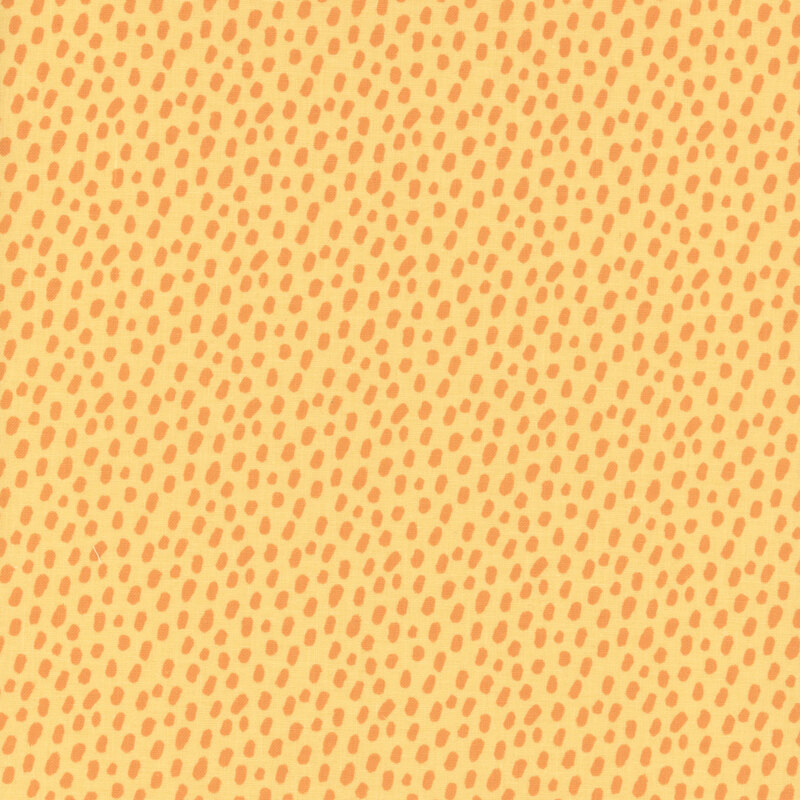 Orange animal spots pattern on yellow fabric