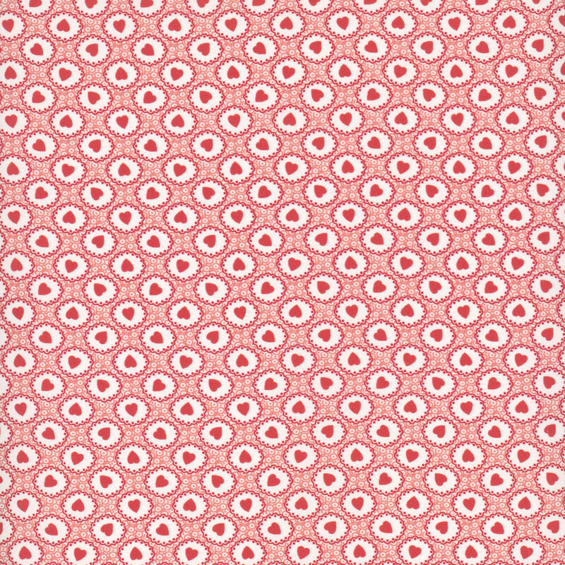 Pattern of white doily shapes with red hearts on a textured, coral pink background 