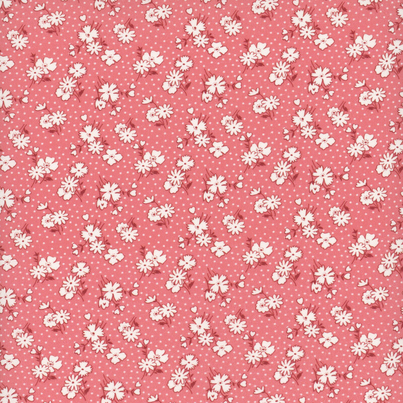 Coral pink fabric featuring white daisy blossoms and hearts with a white dotted background.