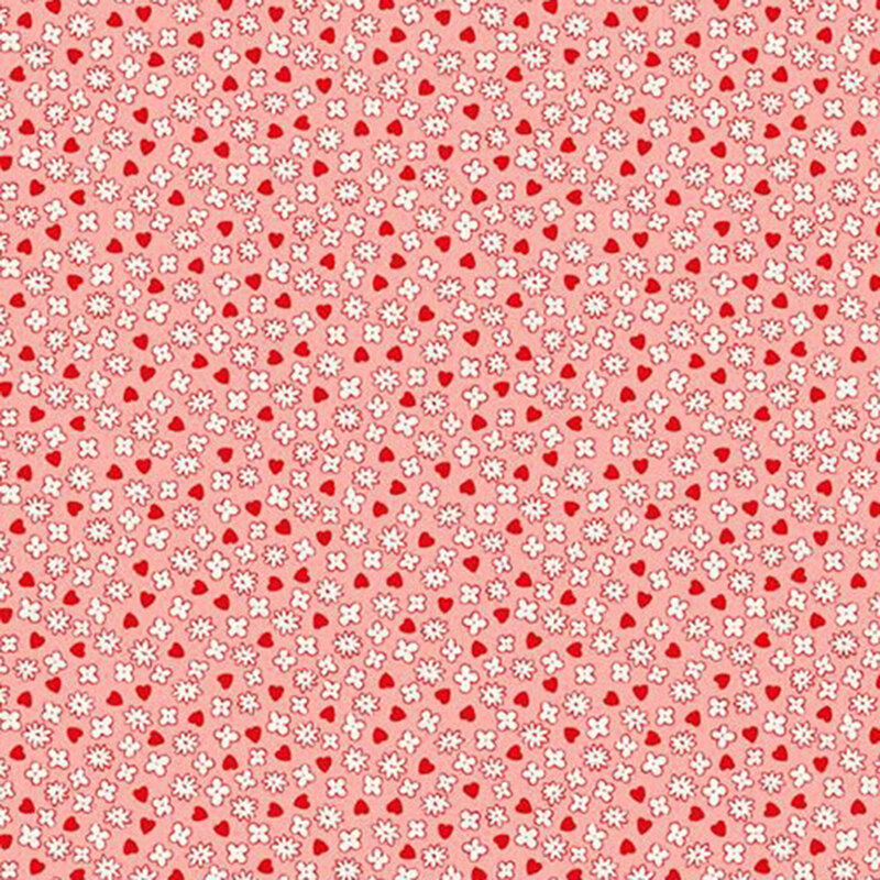 Coral fabric featuring ditzy white mini-flowers and red hearts.