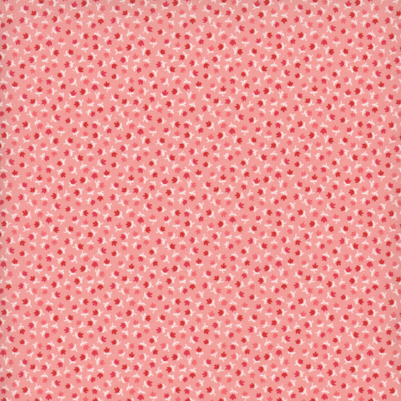 Pink fabric featuring a pattern of small red and coral pink tulips with white stems.