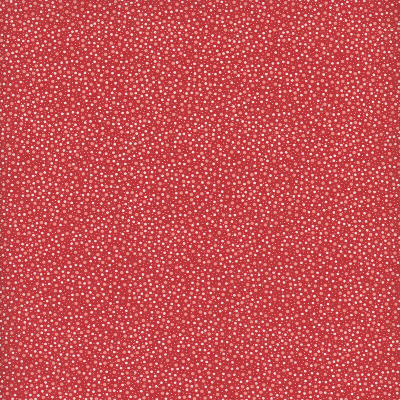 Scarlet red fabric with scattered white and pink colored dots in various sizes.