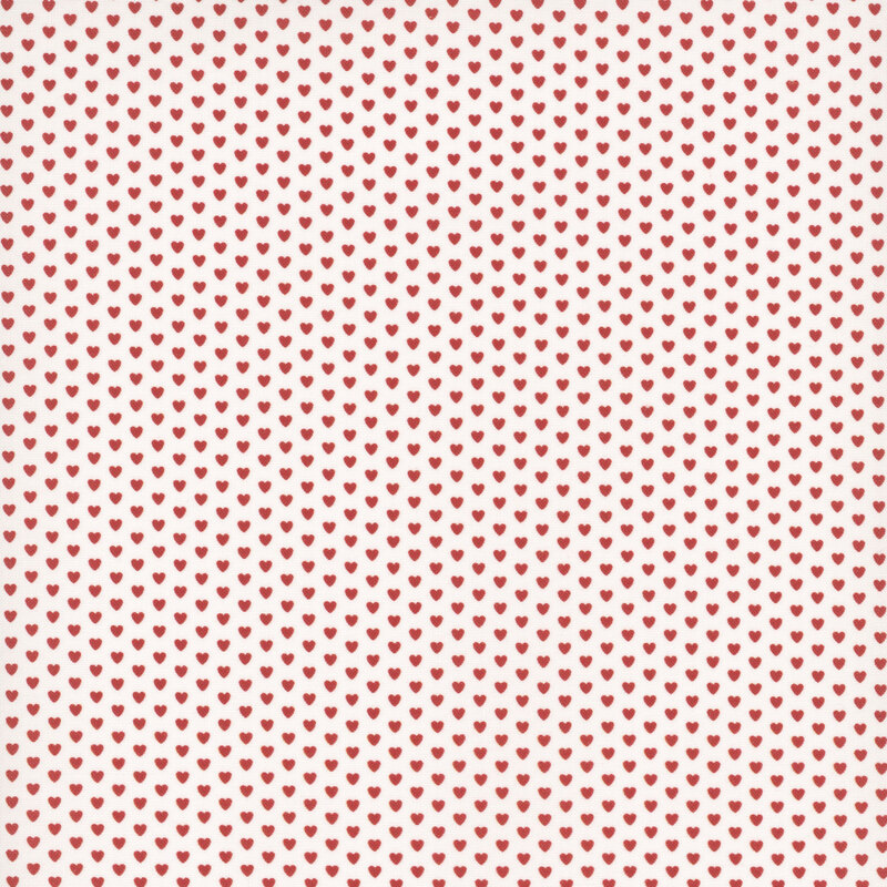 White fabric dotted with evenly spaced rows of cherry red hearts