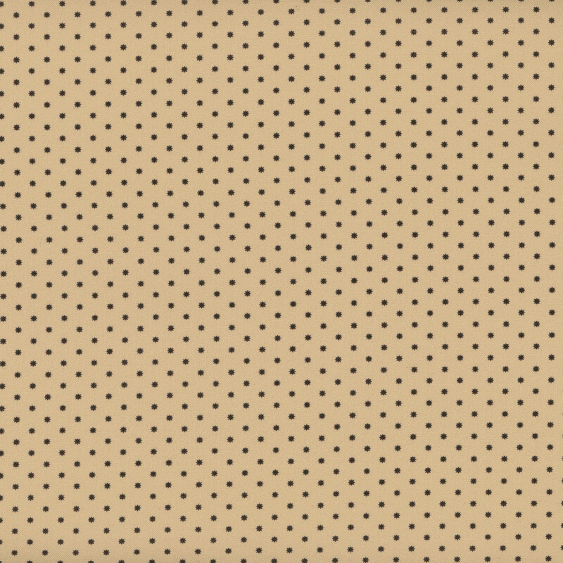 tan fabric featuring rows of small dark brown stars.