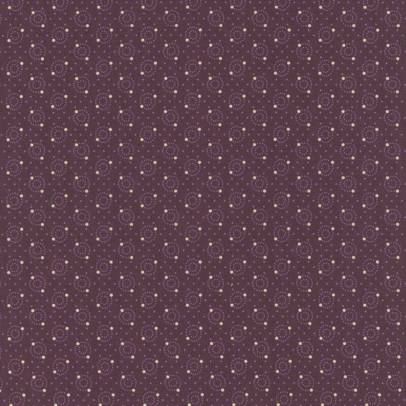 Pattern of small circle designs in light purple on a dark purple fabric.