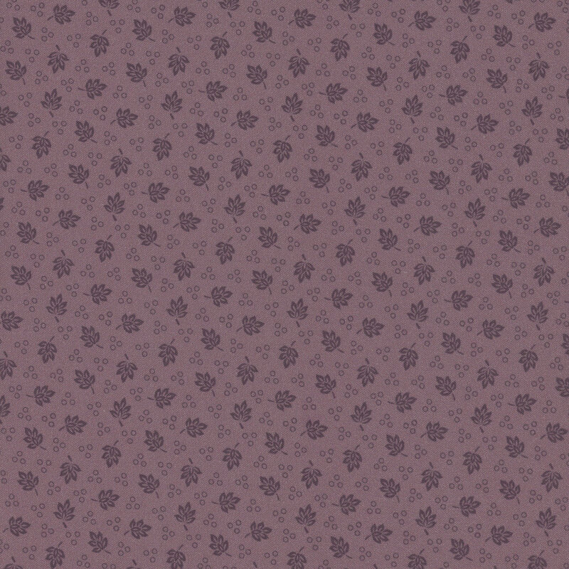 A purple fabric with a repeated pattern of ditsy leaves and circles.