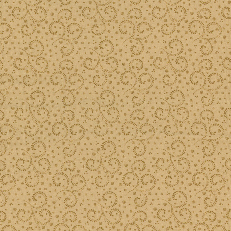 A tonal tan fabric with decorated scrolls and dots.  