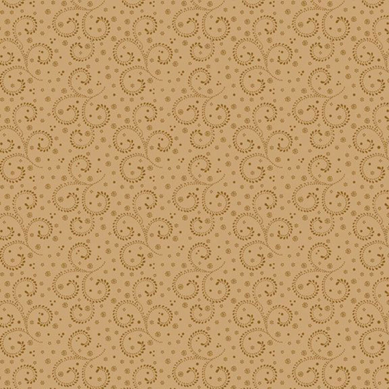 A tonal tan fabric with decorated scrolls and dots.  