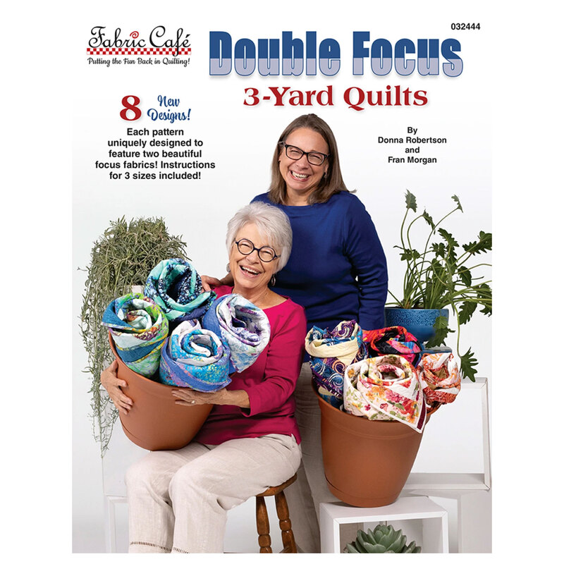 The front of the Double Focus 3-Yard Quilts book, featuring Donna Robertson and Fran Morgan holding baskets of quilts with potted plants in the background.