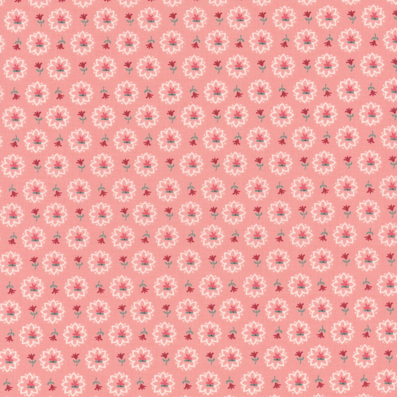 Salmon pink fabric featuring red rosettes tossed with white flower silhouettes.