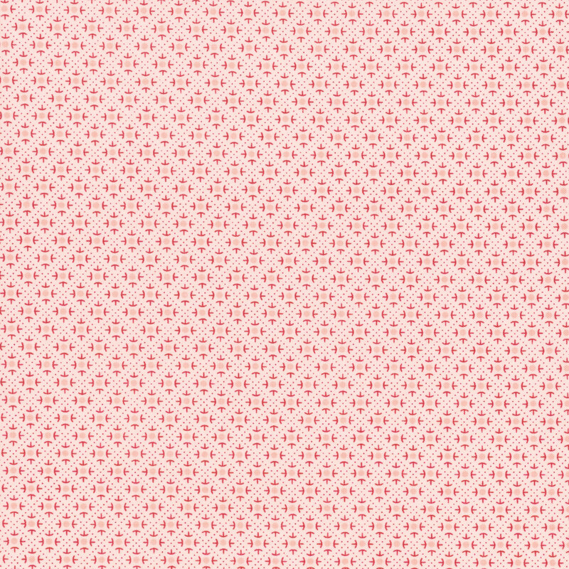 Pink fabric featuring a geometric design.