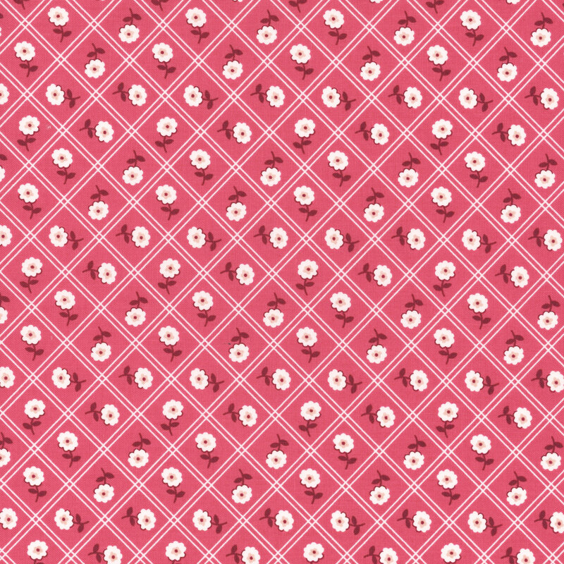 Watermelon red fabric with white flowers inside a white lattice pattern.