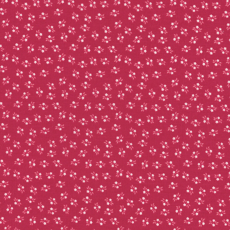 Bright red fabric featuring tossed white flowers.