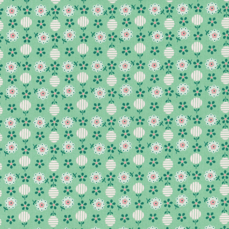 Calico jade green fabric featuring an evergreen and pink floral design.