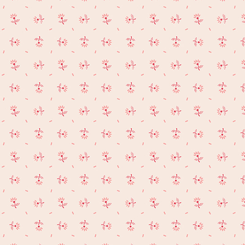 Red flowers and flower petals tossed on ivory fabric.