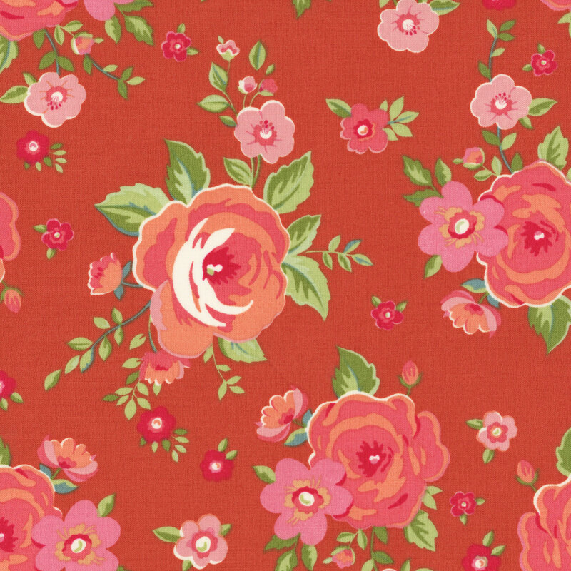 Peach and pink roses tossed on red-orange fabric.
