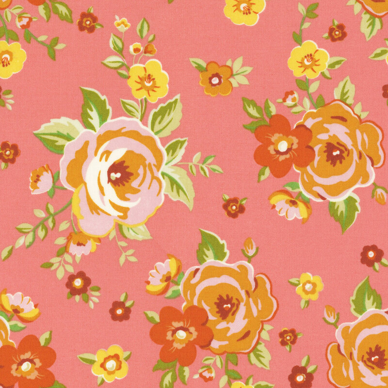 Pink, orange, and russet roses tossed on salmon-orange fabric.