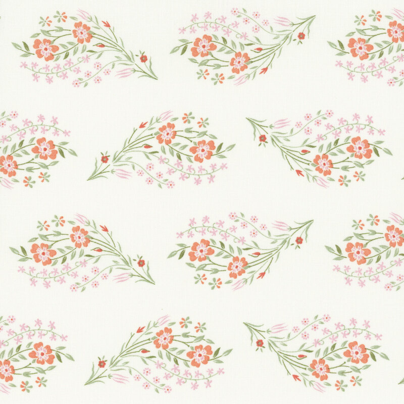 Posies of peach and pink flowers and green stems tossed on cream fabric.