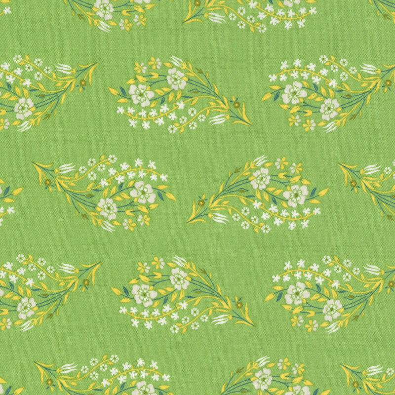 Posies of white flowers with yellow and teal leaves and stems tossed on spring green fabric.