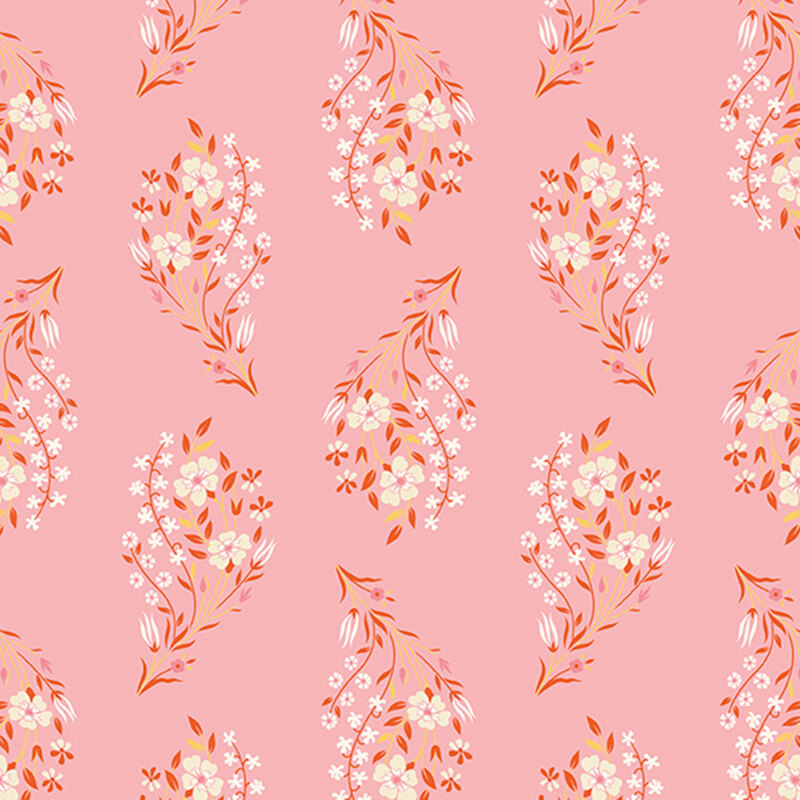 Posies of white flowers with russet and yellow  leaves and stems tossed on salmon pink fabric.
