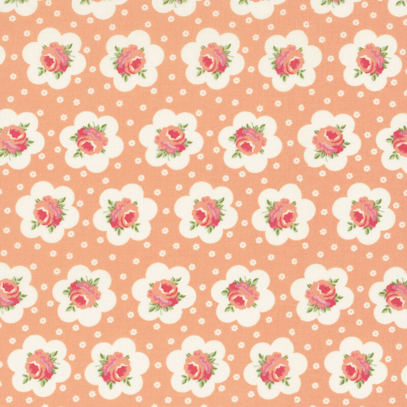 Peach fabric featuring peach-pink roses outlined in a white flower and small white flowers dotting the background.