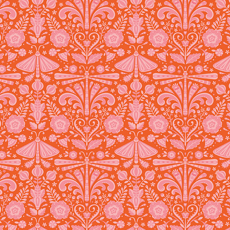 Rusty red fabric featuring salmon-pink symmetrical ornamental designs.