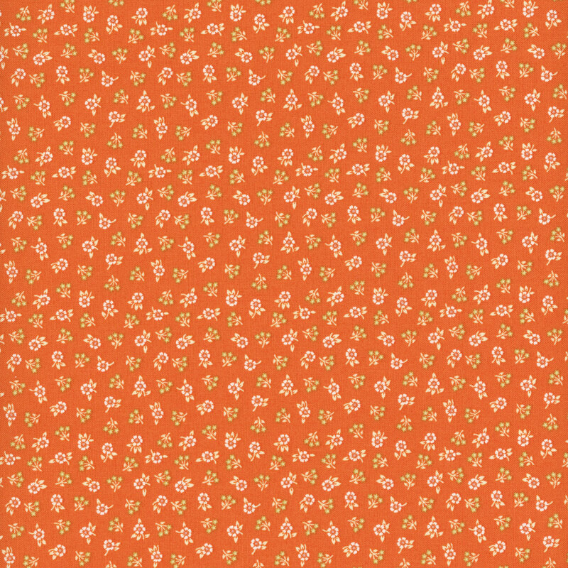 Bright orange fabric featuring a ditsy design of white flowers and yellow sprigs.