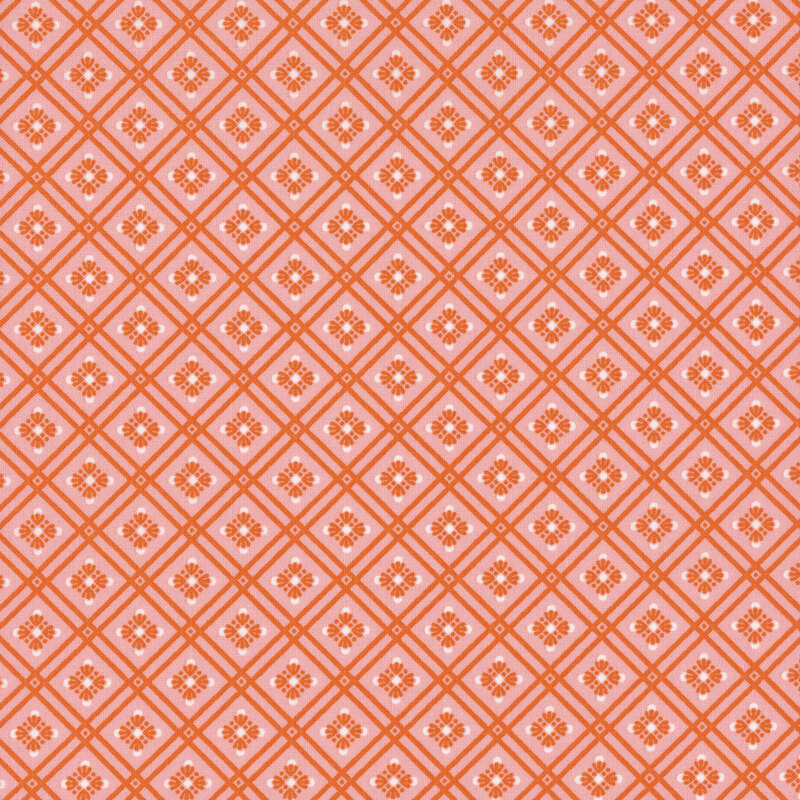 Bubblegum pink fabric featuring a bright orange lattice and floral design.