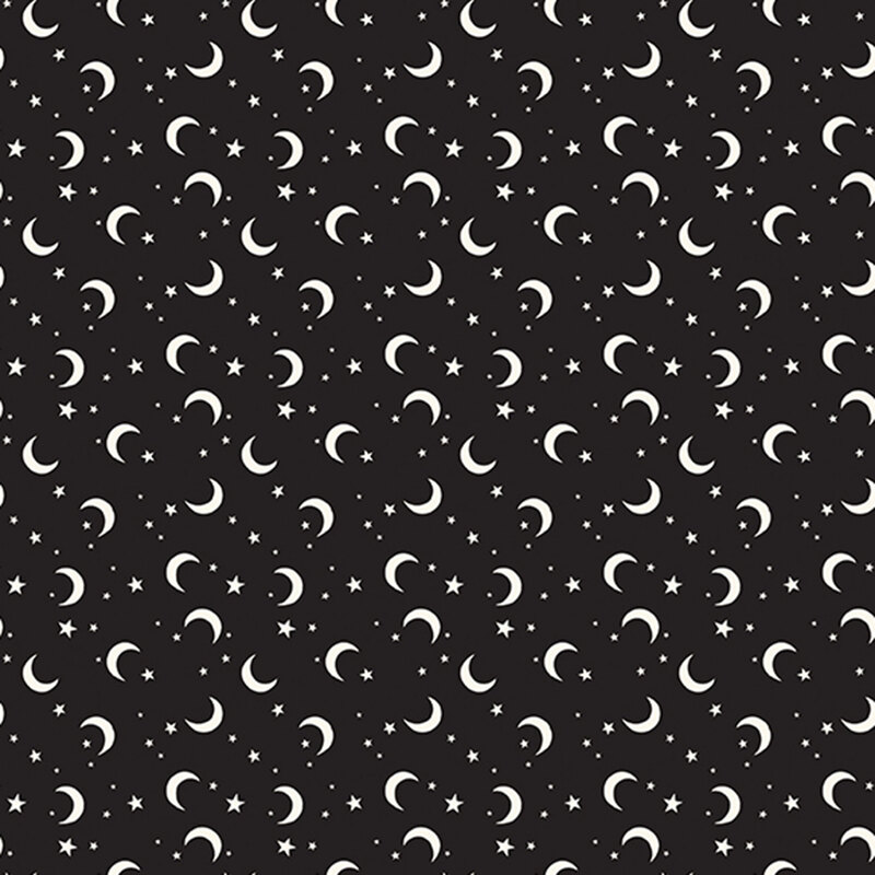 This black fabric features scattered glow in the dark crescent moons and stars.